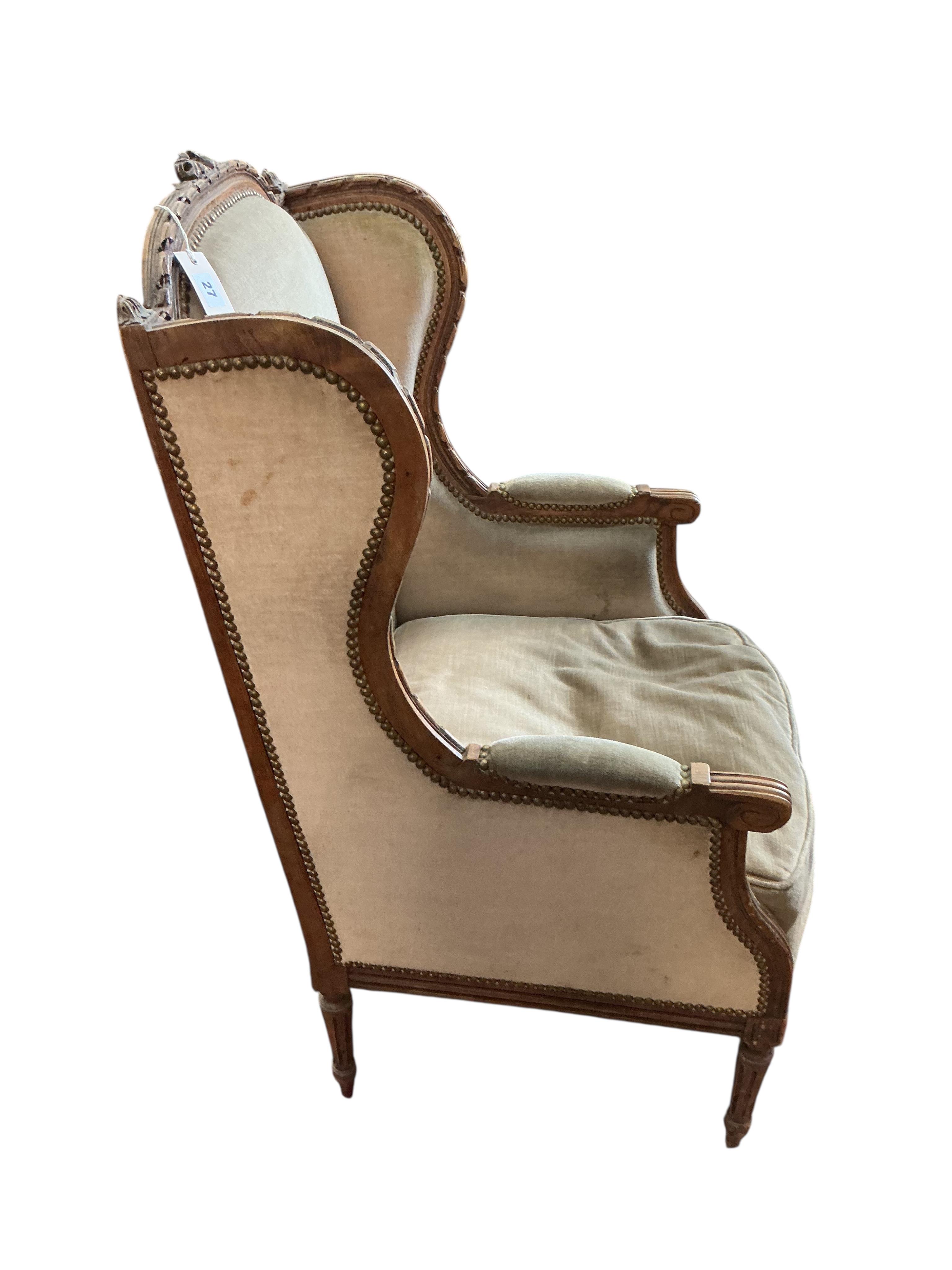 A late19th century French carved beech wing armchair, width 60cm, depth 52cm, height 104cm